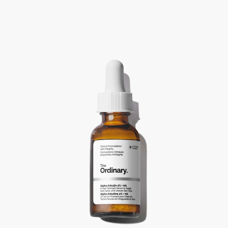 The Ordinary Alpha Arbutin 2% + HA 30ml frosted glass bottle with a dropper, showing the clear, concentrated liquid on a clinical white background.