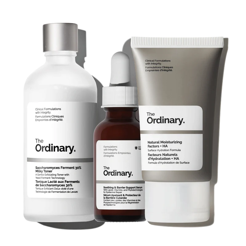 The Ordinary Sensitive Skin Collection featuring the Milky Toner, the pink Soothing & Barrier Support Serum, and NMF + HA moisturizer on a clean white background.