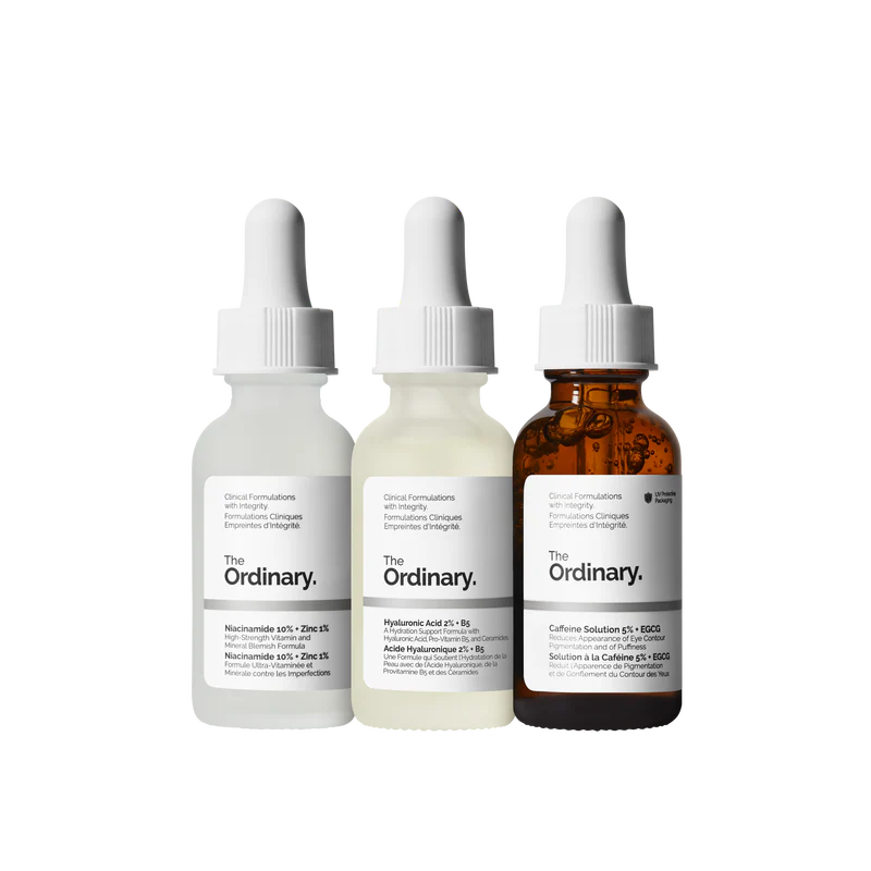 The Ordinary Most Loved Collection featuring three 30ml bottles—Niacinamide, Hyaluronic Acid, and Caffeine Solution—arranged on a minimalist white shelf.