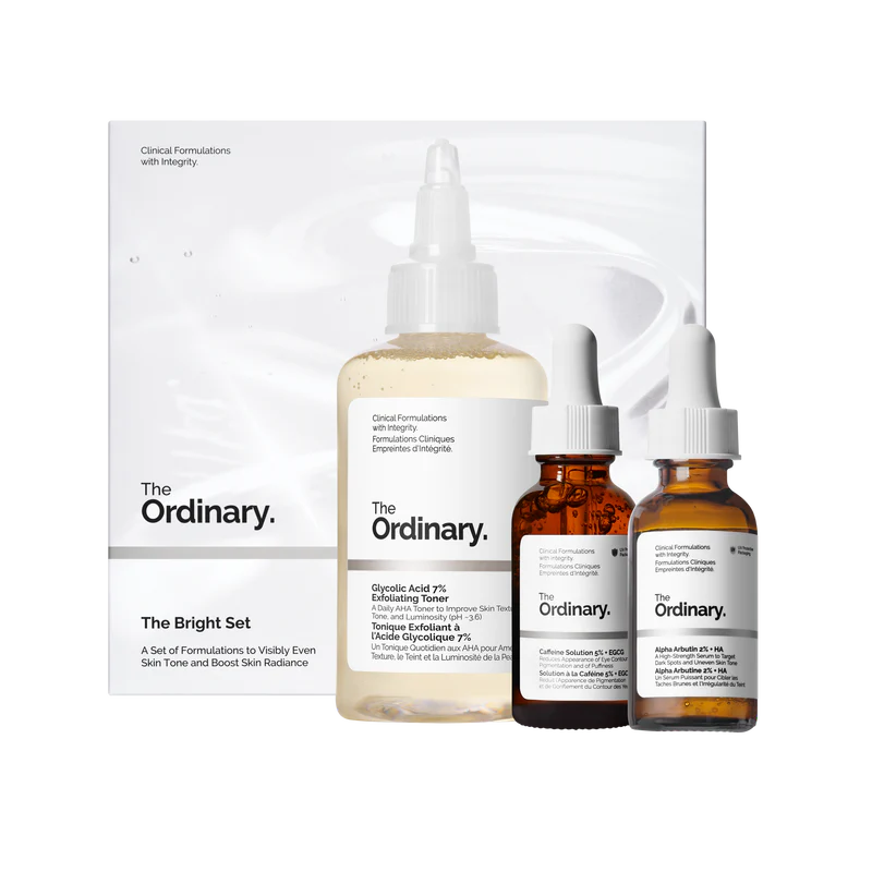 The Ordinary Bright Set featuring full-size bottles of Glycolic Acid 7% Exfoliating Toner, Alpha Arbutin 2% + HA, and Caffeine Solution 5% + EGCG on a minimalist white background.