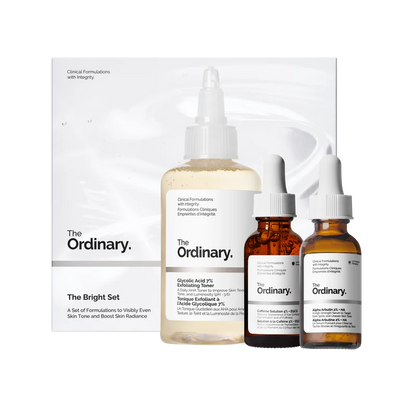 The Ordinary Bright Set featuring full-size bottles of Glycolic Acid 7% Exfoliating Toner, Alpha Arbutin 2% + HA, and Caffeine Solution 5% + EGCG on a minimalist white background.