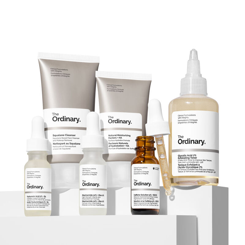 The Ordinary Mini Discovery Set box and six miniature bottles/tubes arranged neatly on a clinical white surface.
