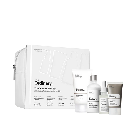 The Ordinary Winter Skin Set featuring Glycolipid Cream Cleanser, Saccharomyces Ferment 30% Milky Toner, Hyaluronic Acid 2% + B5, and Natural Moisturizing Factors + HA in a sleek, travel-friendly pouch.