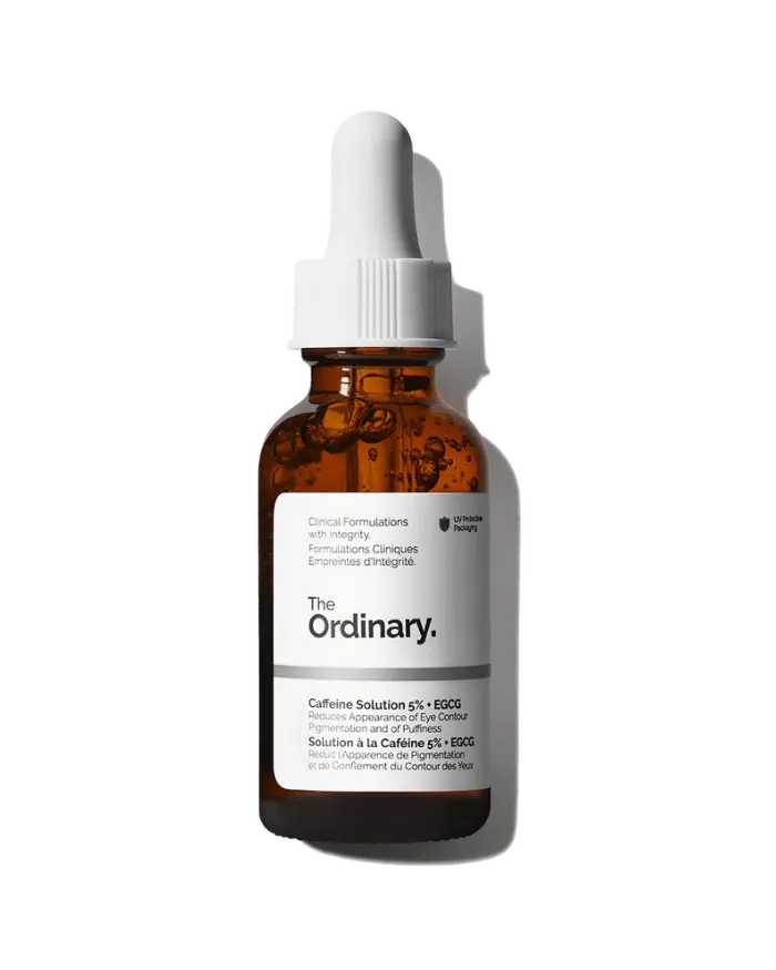 The Ordinary Caffeine Solution 5% + EGCG 30ml amber glass bottle with a dropper, designed to protect the light-sensitive formula.