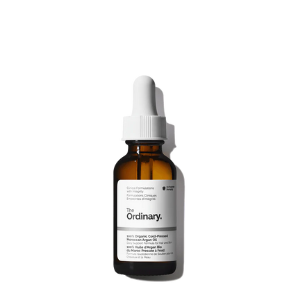 The Ordinary 100% Organic Cold-Pressed Moroccan Argan Oil 30ml amber glass bottle with a dropper, containing pure, unrefined golden oil for skin and hair.